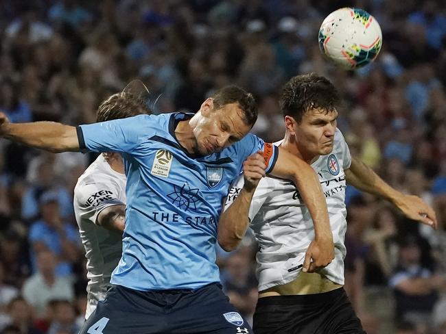 Alex Wilkinson of Sydney FC goes up for a header with Curtis Good of Melbourne City during the Round 12 A-League match between Sydney FC and Melbourne City FC at Netstrata Jubilee Stadium in Sydney, Sunday, December 29, 2019. (AAP Image/Mark Evans) NO ARCHIVING, EDITORIAL USE ONLY