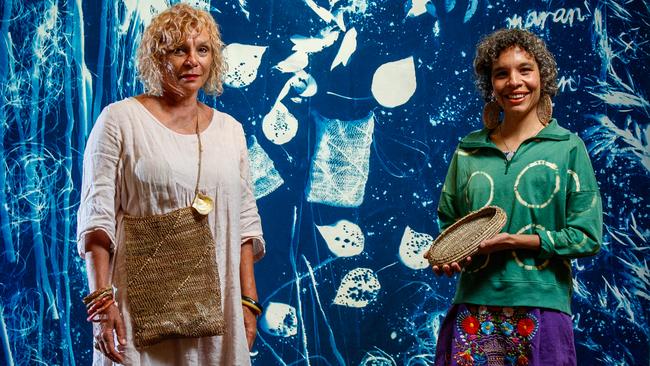 North Stradbroke Island artists, mother and daughter Sonja and Elisa Jane Carmichael with their weaving and cyanotype works at the Tarnanthi: Open Hands exhibition, Art Gallery of SA. Picture: Matt Turner