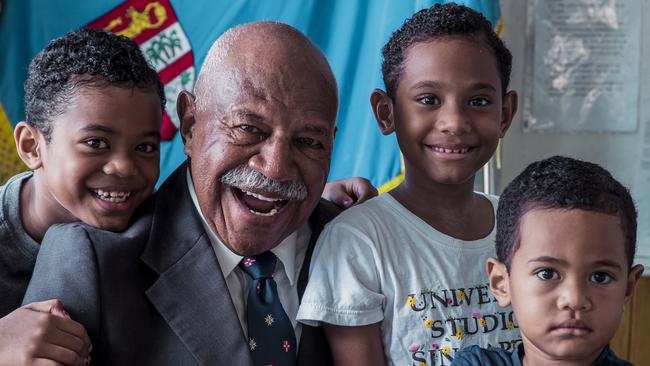 Prime Minister Sitiveni Rabuka at his home in Suva with his great-grandchildren (from left) Claire, Esther an Dallas. Picture: Shiri Ram/The Australian