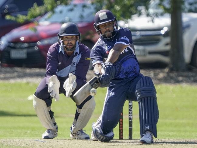 Bucks keeper Troy Aust watches as Berwick batsman Damith Mapa Ralalage hits out. Picture: Valeriu Campan