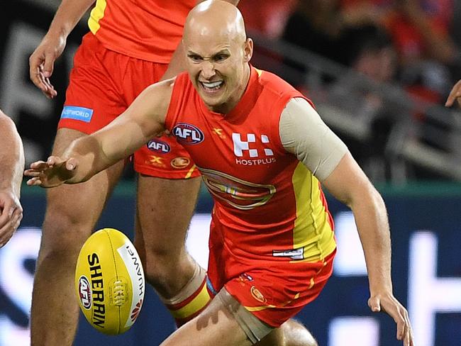 Cats player Patrick Dangerfield (left) competes with Suns player Gary Ablett during the Round 7 AFL match between the Gold Coast Suns and the Geelong Cats at Metricon Stadium in Carrara on the Gold Coast, Saturday, May 6, 2017. (AAP Image/Dave Hunt) NO ARCHIVING, EDITORIAL USE ONLY