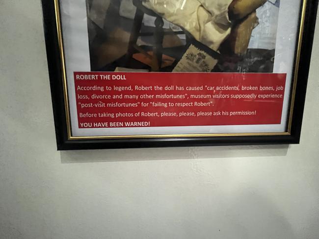 The notice underneath the replica of Robert the Doll.