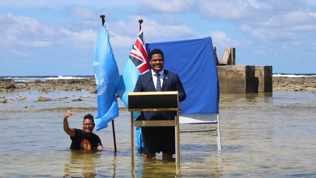 Tuvalu Foreign Minister Simon Kofe made the bold statement at the UN's climate conference in 2021 by standing in the ocean. Picture: Facebook