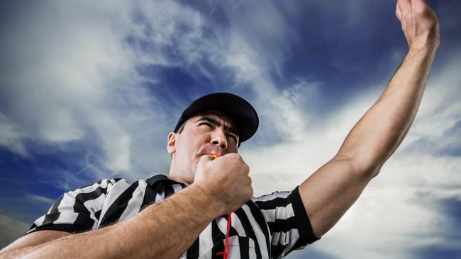 Referee against the clouds.