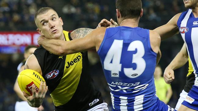 Dustin Martin is taken high by Sam Gibson. Picture: Michael Klein