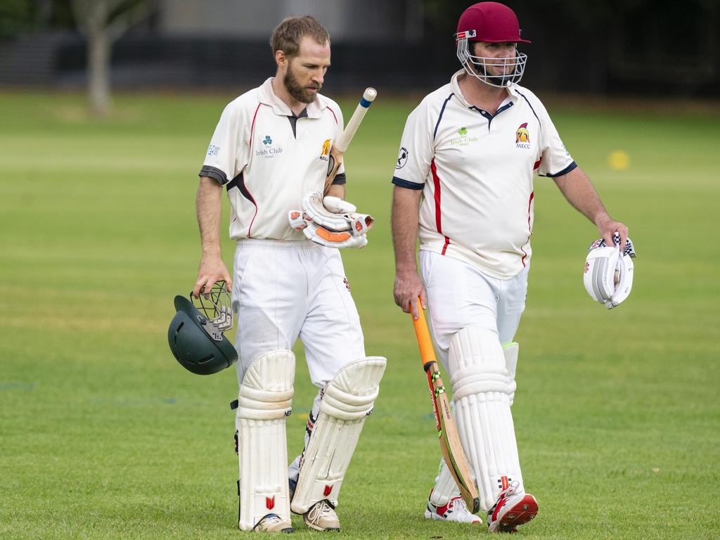 Metropolitan-Easts batsmen Ross Milton (left) and Craig Skuse leave the field during a break in play. Picture: Kevin Farmer.