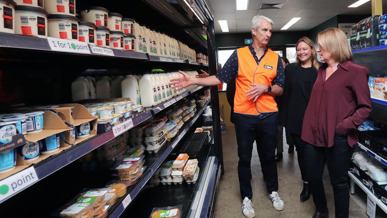 Geelong Foodshare chief executive Andrew Schauble with Lara MP Ella George and Premier Jacinta Allan on Friday. Picture: Alan Barber.