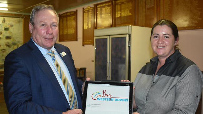 Mayor Paul McVeigh and Chinchilla Community Commerce and Industry manager Robyn Haig checking out the new Buy Western Downs Facebook page.