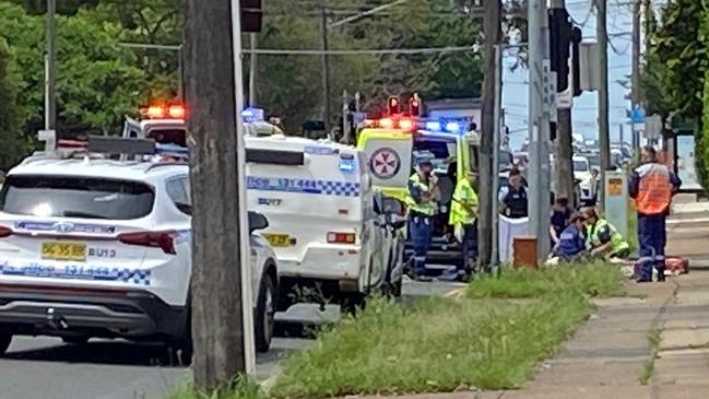 Emergency crews work on the cyclist. Picture: Jo Seymour