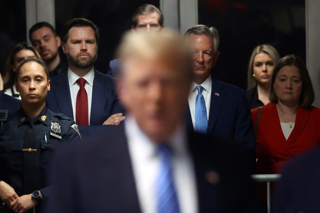 US Senator J.D. Vance, seen here to the left of Donald Trump at the former president's Manhattan criminal trial, is the party's new vice presidential nominee for the 2024 election