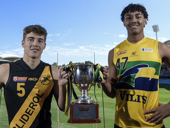 SANFL U18 Grand final captains Hugh Stagg (Glenelg) and Jordan Lukac (Eagles) together with the U18 premiership cup at Adelaide Oval.Wednesday September 15, 2021. Photo: Roy VanDerVegt