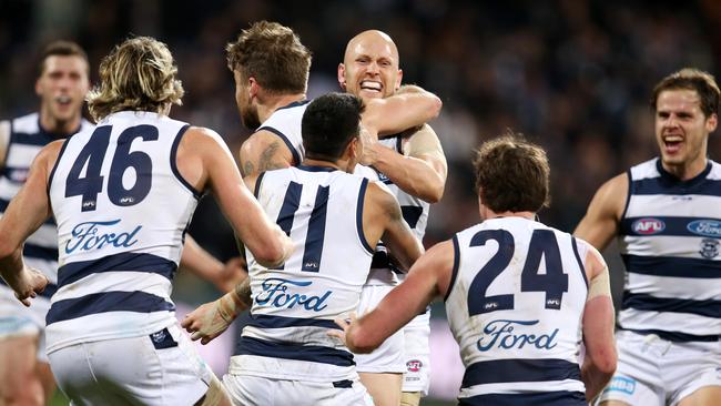 Gary Ablett hugs Zach Tuohy following his after-the-siren matchwinner against the Demons. Picture: Michael Klein