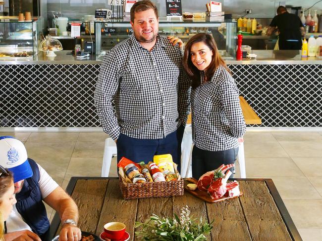 Pup friendly... Orangeville Meat Co founders Shaun and Melissa at the Gregory Hills delic cafe. Picture: Phillip Rogers