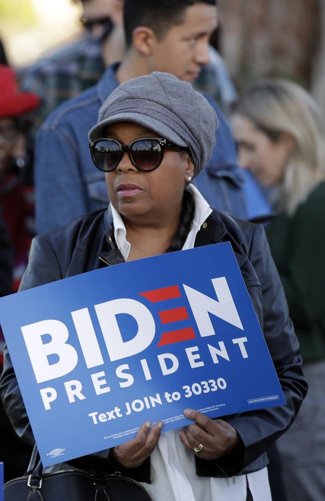 People wait to attend a campaign rally for Democratic presidential candidate former Vice President Joe Biden in Los Angeles. Picture: AP