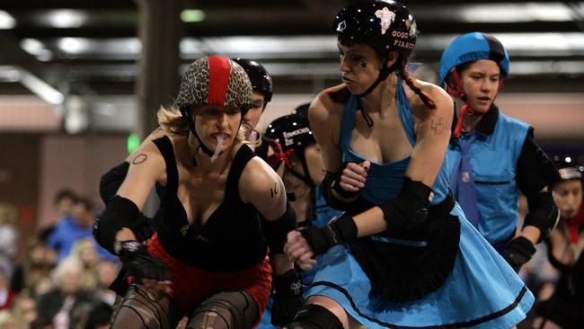 The Road Train Rollers (blue) in action against the Mile Die Club at the Adelaide Showgrounds back in 2009.