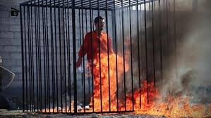 A man purported to be ISIS captive Muath al-Kasasbeh, a Jordanian pilot, is seen standing in a cage as he meets his grisly end. Picture: SITE Intelligence Group