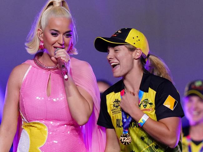 Katy Perry performs on stage with the Sophie Molineux and the Australian women's cricket team after the Women's T20 World Cup final match between Australia and India at the MCG in Melbourne, Sunday, March 8, 2020. (AAP Image/Scott Barbour) NO ARCHIVING, EDITORIAL USE ONLY, IMAGES TO BE USED FOR NEWS REPORTING PURPOSES ONLY, NO COMMERCIAL USE WHATSOEVER, NO USE IN BOOKS WITHOUT PRIOR WRITTEN CONSENT FROM AAP