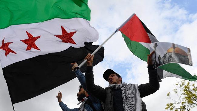 Pro-Palestinian supporters stage a protest in front of the European Commission in Brussels. Picture: AFP