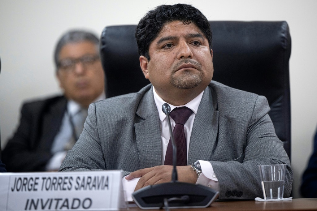 Jorge Torres, former head of Peru's congressional legal and constitutional office, is questioned by a parliamentary oversight committee