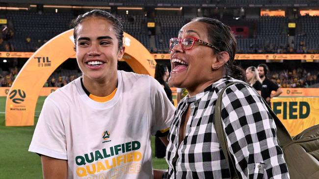 Australia's Mary Fowler (L) is greeted by Cathy Freeman (R) after the women's football qualifying match for the 2024 Paris Olympic Games between Australia and Uzbekistan. (Photo by William WEST / AFP)