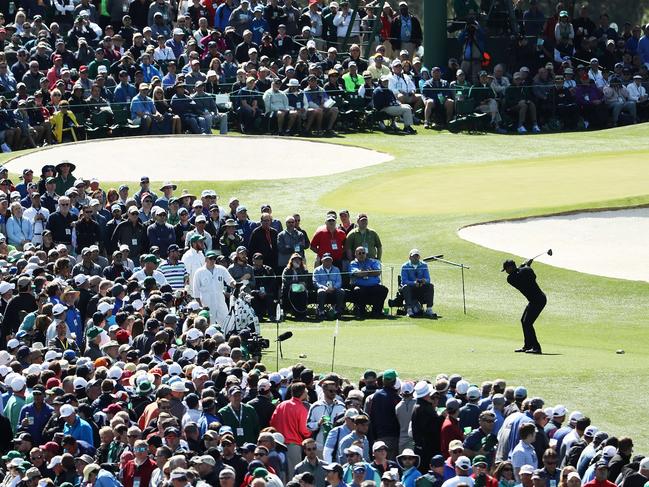 The only player they want to see: Tiger Woods plays a shot from the third tee last year.