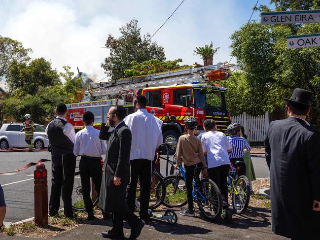 MELBOURNE, DECEMBER 19, 2024: Emergency services respond as a house fire burns in Ripponlea barely 50 metres from the Adass Israel Synagogue. Picture: Mark Stewart