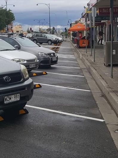 Wheel stops on Semaphore Rd car parks were installed too far away from the curb. Picture: Ashleigh Pisani