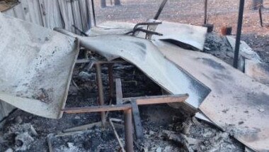 A tangled mess of blackened steel is all that remains of Les Ferguson’s Darwin River home.