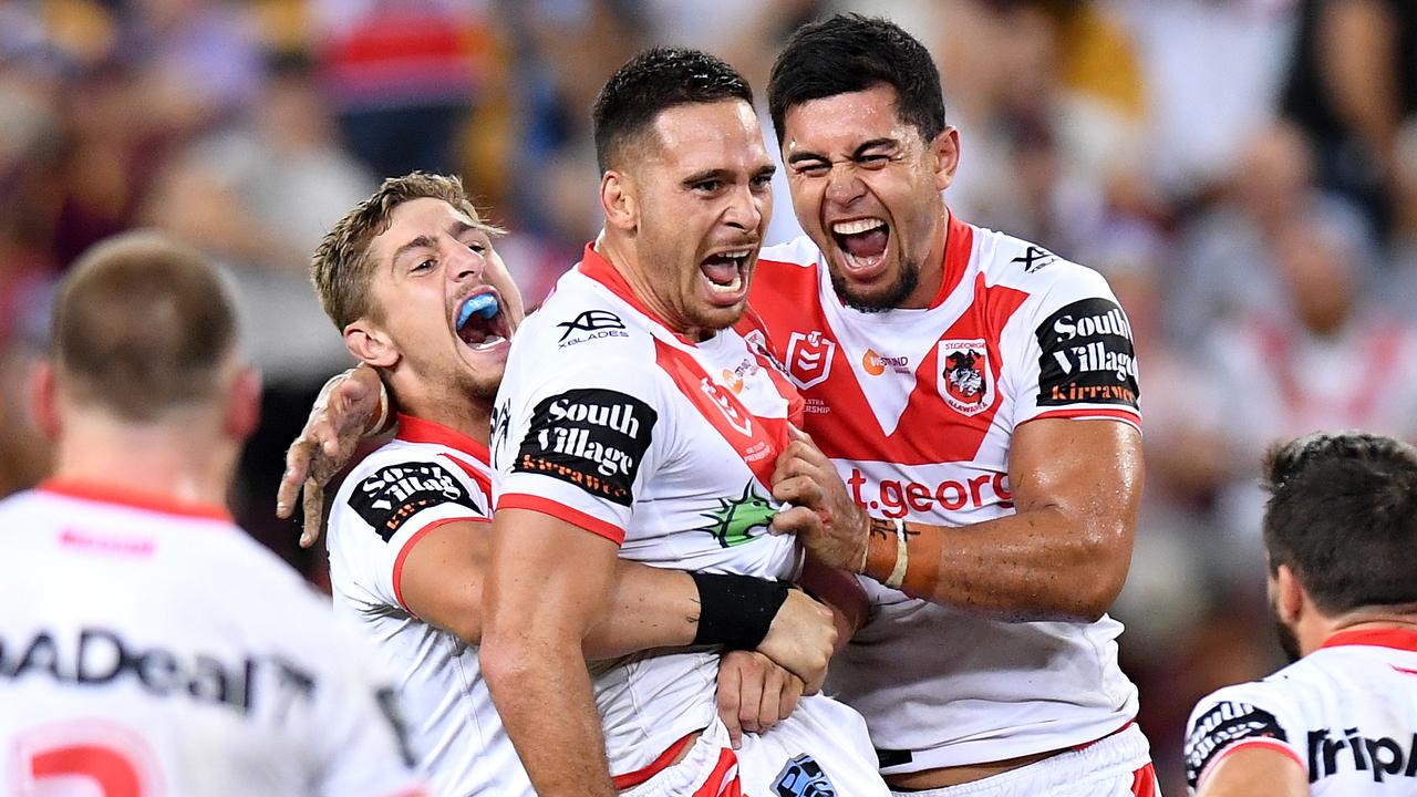 Corey Norman celebrates after kicking the winning field goal for the Dragons against the Broncos.