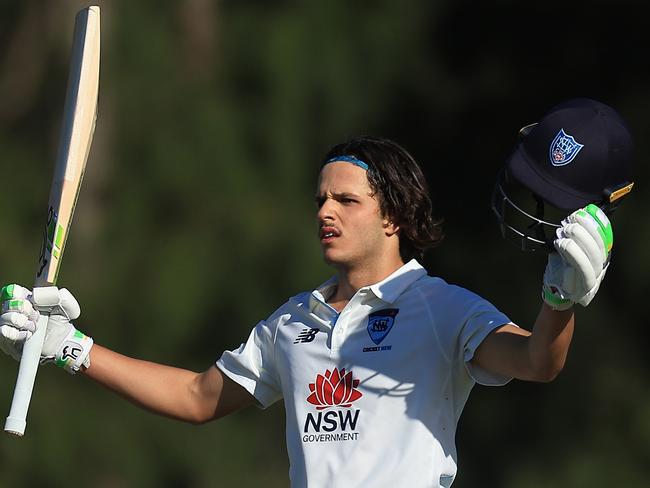 SYDNEY, AUSTRALIA - OCTOBER 10: Sam Konstas of the Blues raises his bat in the air after hitting a six to reach his century during the Sheffield Shield match between New South Wales and South Australia at Cricket Central, on October 10, 2024, in Sydney, Australia. (Photo by Mark Evans/Getty Images)