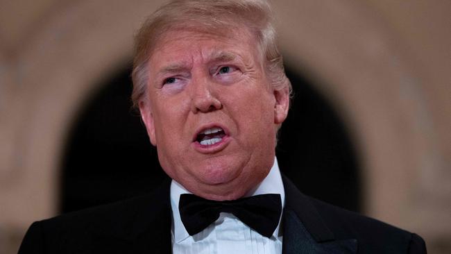 Former US president Donald Trump speaks to the press outside the grand ballroom at Mar-a-Lago.