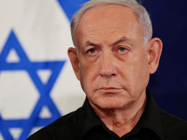 Israeli Prime Minister Benjamin Netanyahu holds a press conference with Defense Minister Yoav Gallant and Cabinet Minister Benny Gantz (not pictured) in the Kirya military base in Tel Aviv , Israel , 28 October  2023.    ABIR SULTAN POOL/Pool via REUTERS