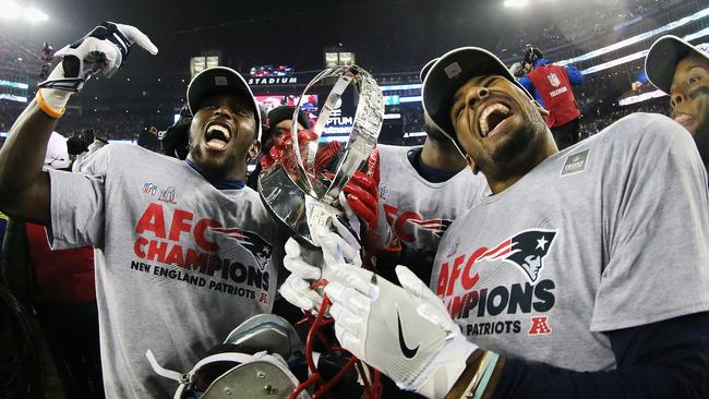 New England Patriots players celebrate after defeating the Pittsburgh Steelers.