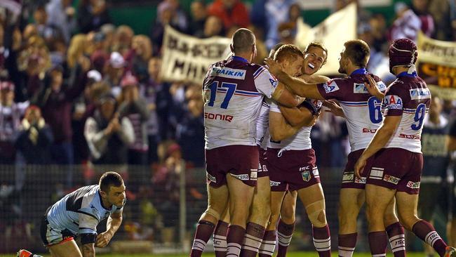 Manly celebrate the try of Tom Symonds.