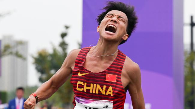 He Jie of China celebrates after winning the men’s marathon at the Asian Games in 2023. (Photo by CHINASPORTS/VCG via Getty Images)