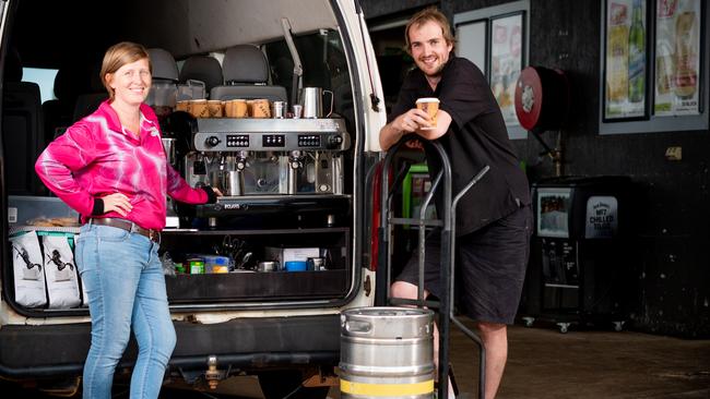 Berry Springs Tavern bar manager Liz Lamb and bottleshop attendant Michael Wass are serving takeaway coffee from a converted bus during the coronavirus lockdown. Picture: Che Chorley