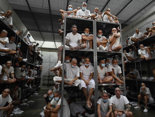 Inmates remain in a cell at the Counter-Terrorism Confinement Centre (CECOT) mega-prison, where hundreds of members of the MS-13 and 18 Street gangs are being held, in Tecoluca, El Salvador on January 27, 2025. The CECOT, the largest prison in Latin America and emblem of the war against gangs of the government of President Nayib Bukele, celebrates two years since it was inaugurated on February 1. (Photo by Marvin RECINOS / AFP)