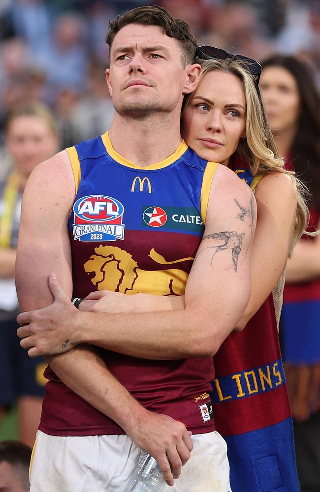 Jules comforts Lachie after the Lions were defeated by the Magpies during the 2023 AFL Grand Final in 2023. Picture: Getty Images