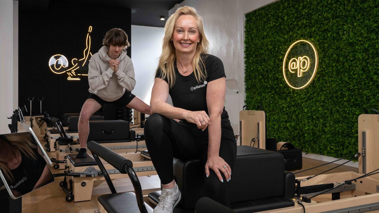 Owner Kirsteen Warrington with studio manager Jack Barton at a new 24/7 pilates studio in central Geelong. Picture: Brad Fleet.