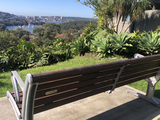 A seat, with a memorial plaque attached, at Guganagina Lookout, Balgowlah Heights, facing east towards North Harbour and Manly, Cove. Picture: Jim O’Rourke