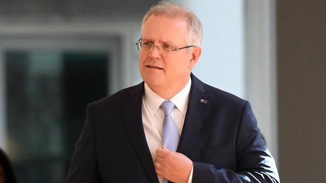 Federal Treasurer Scott Morrison arrives for the Liberal Party room meeting at Parliament House this afternoon.