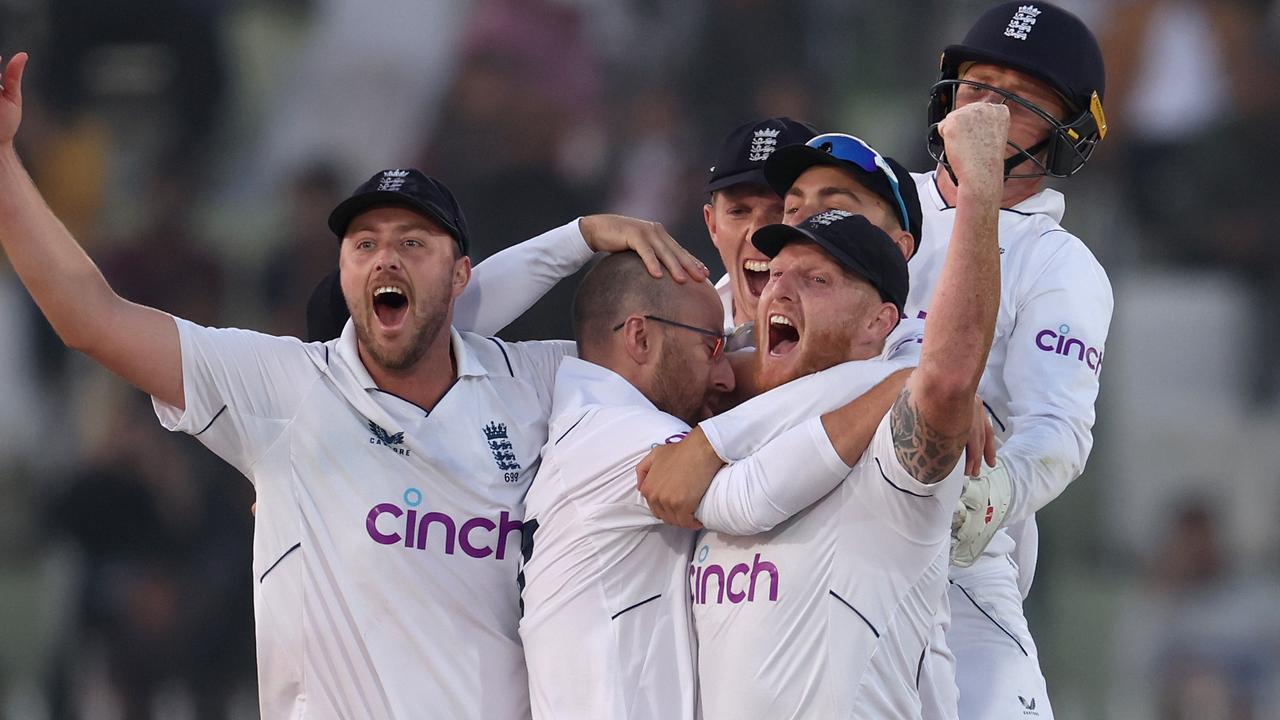 RAWALPINDI, PAKISTAN - DECEMBER 05: Ollie Robinson, Jack Leach and Ben Stokes of England celebrate winning the First Test Match between Pakistan and England at Rawalpindi Cricket Stadium on December 05, 2022 in Rawalpindi, Pakistan. (Photo by Matthew Lewis/Getty Images)