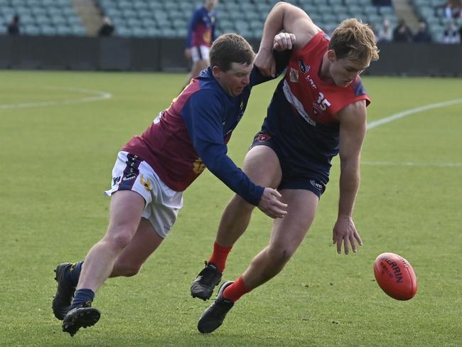 Old Scotch’s Tim Walker and Lilydale player Luke Walsh vie for possession Picture: Scott Gelston / Solstice Digital