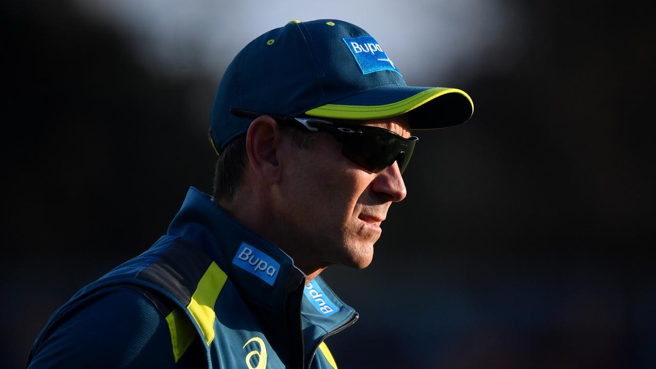 Australia's cricket coach Justin Langer watches his players during warm up before the T20 International cricket match between Australia and Pakistan at Manuka Oval in Canberra, Tuesday, November 5, 2019. (AAP Image/Mick Tsikas) NO ARCHIVING, EDITORIAL USE ONLY, IMAGES TO BE USED FOR NEWS REPORTING PURPOSES ONLY, NO COMMERCIAL USE WHATSOEVER, NO USE IN BOOKS WITHOUT PRIOR WRITTEN CONSENT FROM AAP