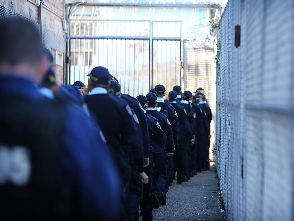 Correctional officer trainees head into Long Bay Jail for a search training session. Picture: Tim Hunter