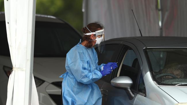 People are tested for Covid-19 at Southport on January 05, 2022 in Gold Coast, Australia. Queensland is experiencing record-high COVID-19 cases for the state, creating challenges for testing clinics. (Photo by Chris Hyde/Getty Images)