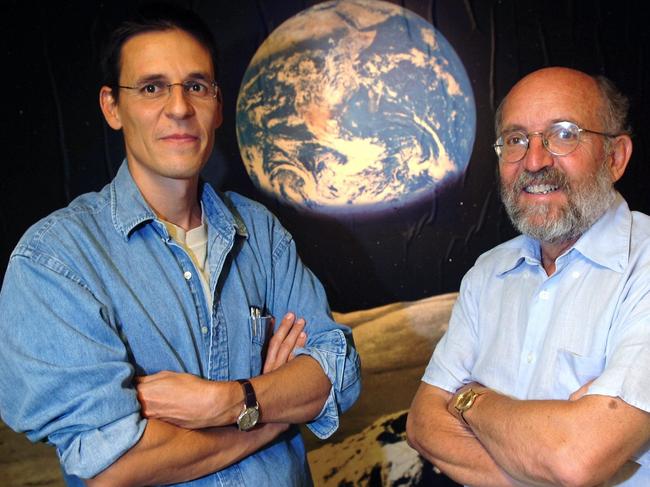 FILE - In this Thursday, Aug. 11, 2005 file photo Swiss Astronomers Michel Mayor, right, and Didier Queloz, left, pose for the photographer at the Astronomical Observatory of the University of Geneva. The 2019 Nobel prize in Physics was given to James Peebles "for theoretical discoveries in physical cosmology," and the other half jointly to Michel Mayor and Didier Queloz "for the discovery of an exoplanet orbiting a solar-type star," said Prof. Goran Hansson, secretary-general of the Royal Swedish Academy of Sciences that chooses the laureates. (Laurent Gillieron, Keystone via AP)