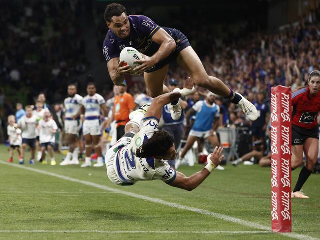 MELBOURNE, AUSTRALIA - MARCH 16: Xavier Coates of the Storm scores the match winning try during the round two NRL match between Melbourne Storm and New Zealand Warriors at AAMI Park, on March 16, 2024, in Melbourne, Australia. (Photo by Daniel Pockett/Getty Images)