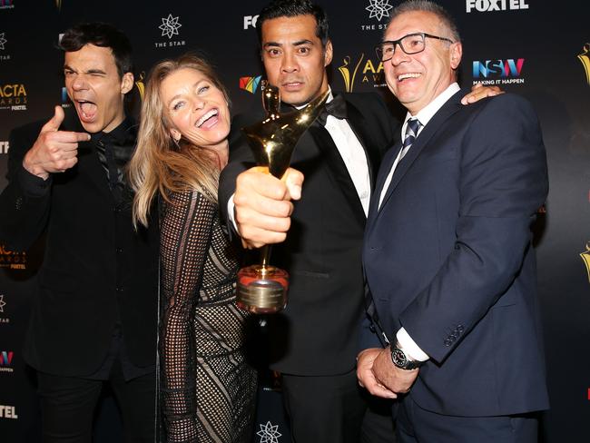 Socratis Otto, Tammy MacIntosh, Robbie Magasiva and Pino Amenta pose in the media room after winning the AACTA Award for Best Television Drama Series for Wentworth. Picture: Caroline McCredie/Getty