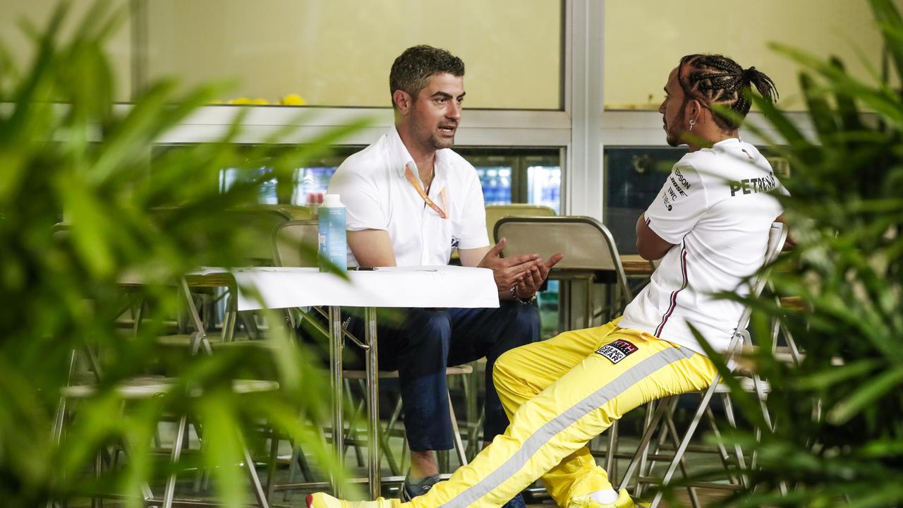 Race director Michael Masi and Lewis Hamilton in deep discussion in 2019 in Singapore. Two years before Masi made the call that cost Hamilton an eighth world title. Photo: Florent Gooden / DPPI